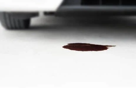 What are the signs of an oil leak